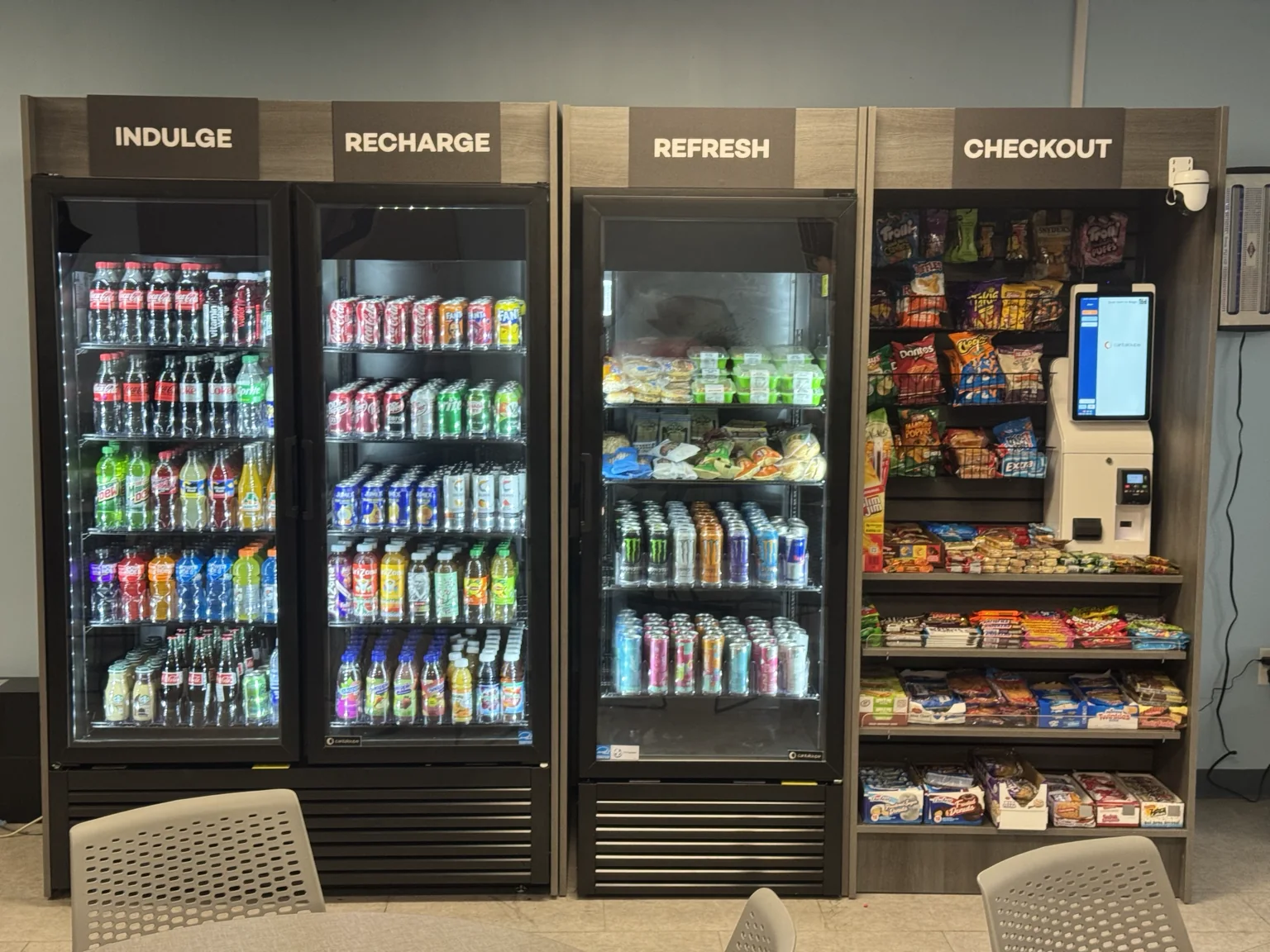 Micro market with coolers and a self-checkout kiosk