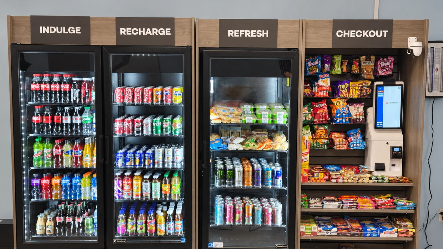 Micro market with drink coolers, fresh food, and a self-checkout kiosk